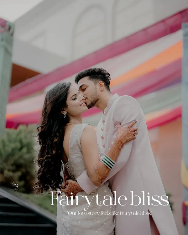 Fairytale bliss. An intimate and romantic kiss against a colorful backdrop, this shot is the epitome of a happy ending turning into a beautiful beginning.