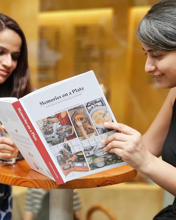 This book, 'Memories on a Plate', began during lockdown as a postcard exchange to share recipes and love. It grew into a collection of over 100 food memories from families across the world.