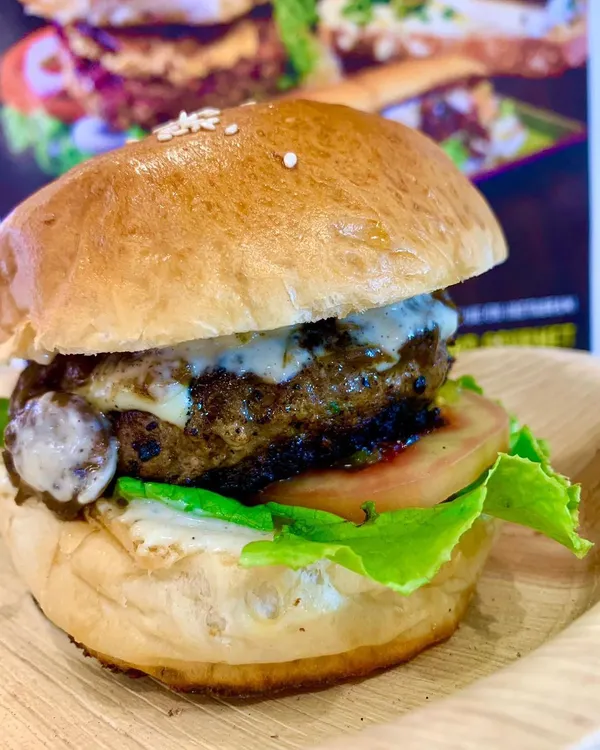 This is my caramelised oyster mushroom burger, a favourite even among meat lovers. The patty is spiced with a desi mix of coriander and jeera for that deep, umami flavour that makes it a truly satisfying gourmet burger experience.