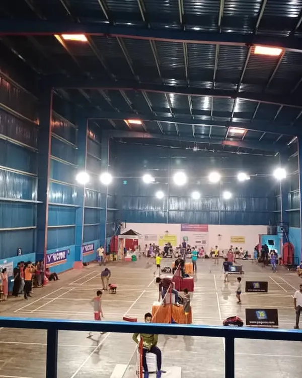 This is the energy you can expect at my Indirapuram center. This high-angle view shows multiple badminton matches in full swing during a championship, with ample space for players, officials, and spectators. My arena is designed to handle the excitement of a large-scale tournament.