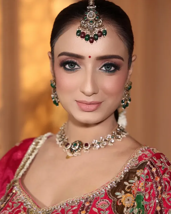 Look at her beautiful eyes. I created a soft smokey eye with a sharp wing to make them pop, giving her that perfect, mesmerizing bridal gaze.