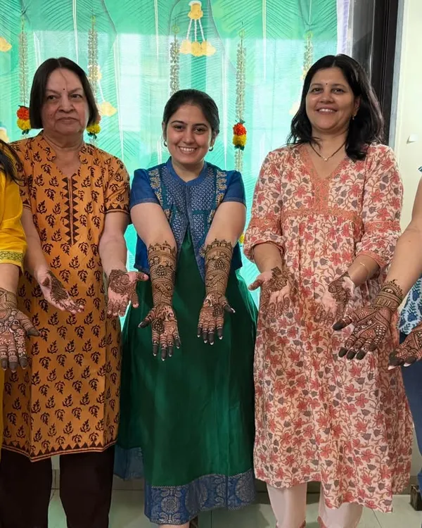 A group of happy clients showing off their party mehendi. It's so much fun getting henna done with your friends and family.
