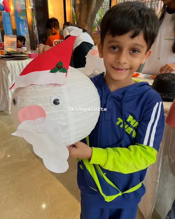This is what it's all about. That proud smile when a child holds up something they created with their own two hands. This little artist just finished his Santa lantern, and his joy is the best part of my job.