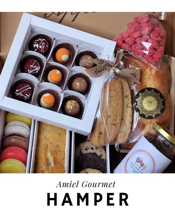 My gourmet hampers are filled with an assortment of my finest creations. This box includes chocolate bonbons, macarons, cookies, a tea cake, and more, making it a truly luxurious gift.