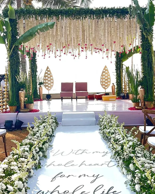 We believe in creating a path to your new beginning that is as beautiful as the journey itself. This stunning beachside wedding features a custom aisle runner, leading to a mandap where traditional elements meet coastal serenity.