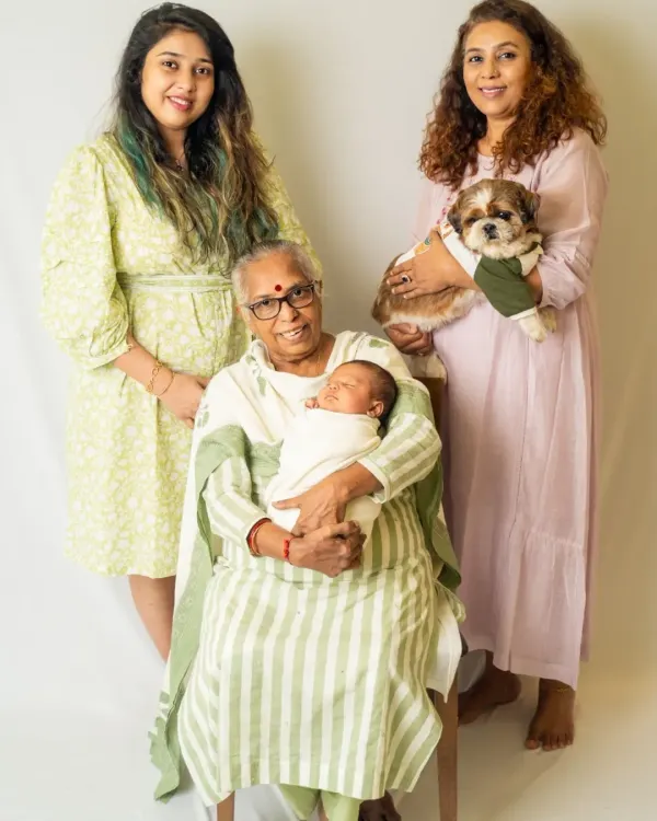 Four generations of love in one beautiful photograph. We were honored to capture this incredible family portrait with the great-grandmother, grandmother, mother, newborn, and family pet.