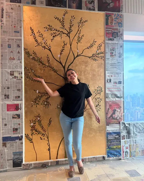 A proud moment with my 85th gold leaf wall mural. Standing next to the finished piece gives a great sense of the scale and how it can become the centerpiece of a room.