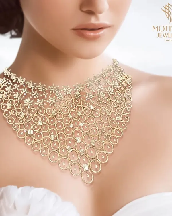 A breathtaking bridal collar necklace, crafted from a delicate web of gold and diamonds. This piece is designed to sit gracefully on the collarbone, creating a statement of pure opulence and sophistication.