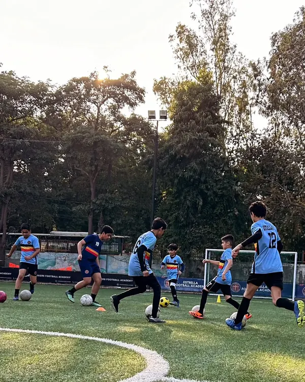 A typical training day at our academy where players are engaged in various dribbling and ball control exercises. My program emphasizes constant movement and repetition to build muscle memory and confidence.
