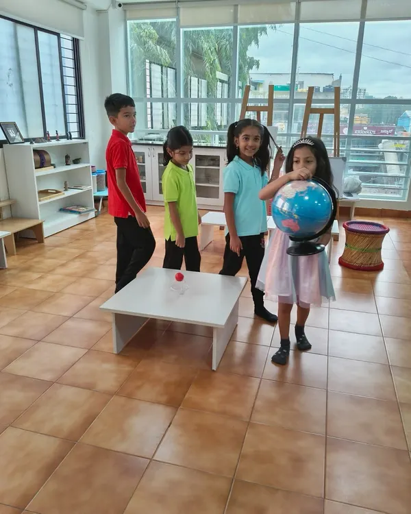 A Birthday Walk is a special tradition at our school. The child holds a globe and walks around a "sun," once for each year of their life, helping them understand the passage of time and their own growth.