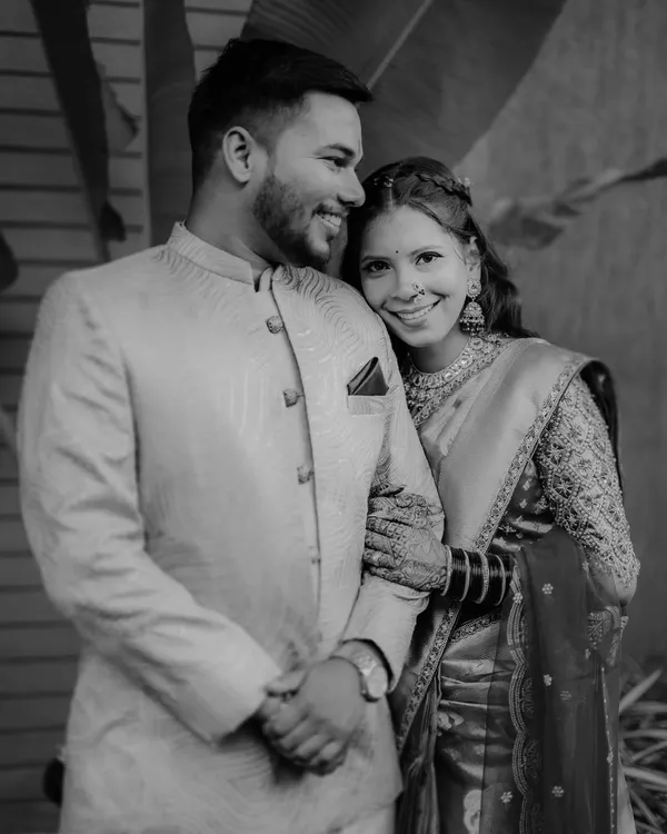 A timeless black and white portrait of Karishma and Bhaskar. The classic monochrome effect emphasizes their happy expressions and strong connection.