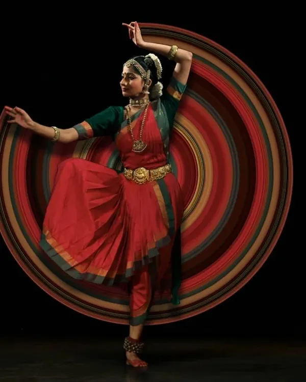 This image captures the dynamic energy and grace of Bharatanatyam. The motion blur effect, created with a slow shutter speed, represents the flow of movement and the spiritual energy that I channel in my solo dance performances.