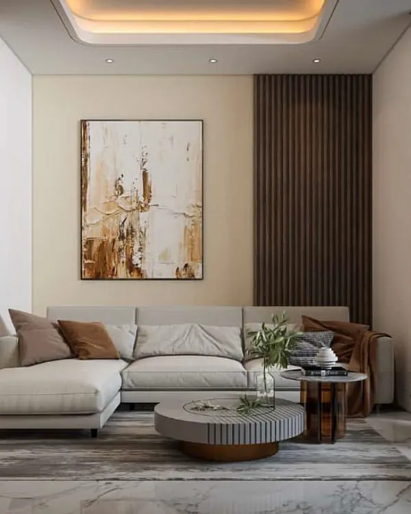 This is a 3D visualization I created for a client's proposed drawing room, which helps them see the full potential of their space before execution begins. The design features a modern L-shaped sofa, a fluted wood accent wall, and abstract art, establishing a contemporary and warm aesthetic.