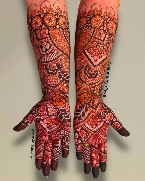 A stunning full-coverage bridal design that extends to the elbows. This piece is packed with intricate floral work, paisleys, and delicate checkered patterns for a truly grand look.