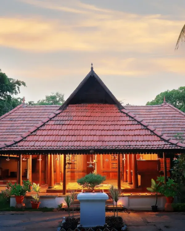 This is the Aranmula Palace, our reception and administration block, glowing at sunset. Originally the Queen's Palace of a royal family, this 200-year-old Nalukettu Kovilakam welcomes you with a grandeur that sets the stage for a truly regal healing experience.
