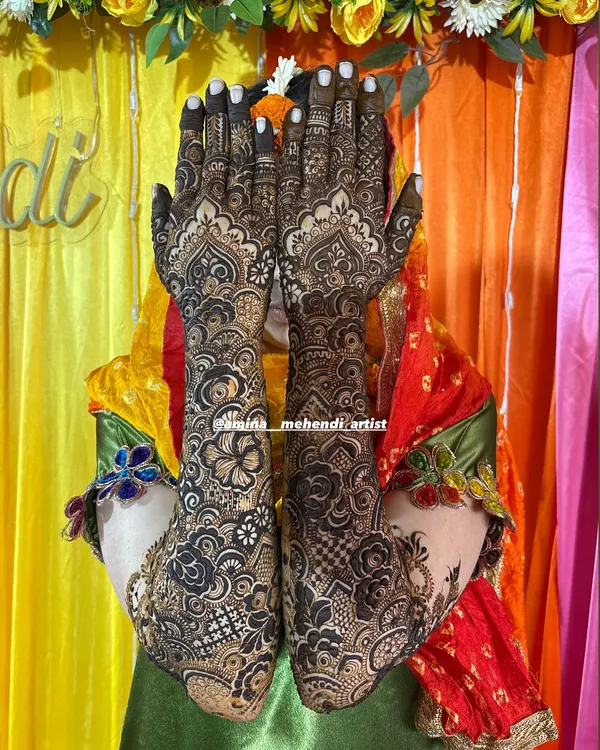 This is my signature full bridal mehendi. I love creating these dense, elaborate designs that cover the hands and arms, ensuring you look absolutely stunning on your big day.