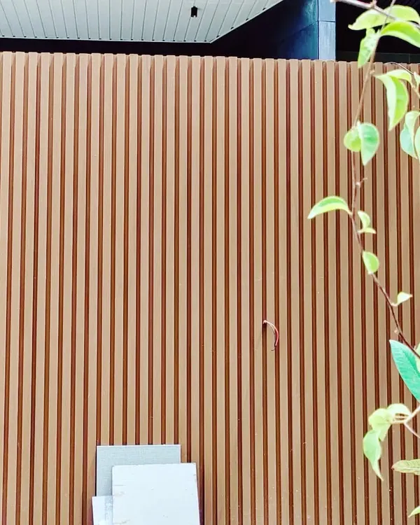 A close-up of a fluted wall panel, a signature element in many of my modern designs. The vertical grooves create a beautiful play of light and shadow, adding texture, rhythm, and a sense of refined detail to the building's facade.