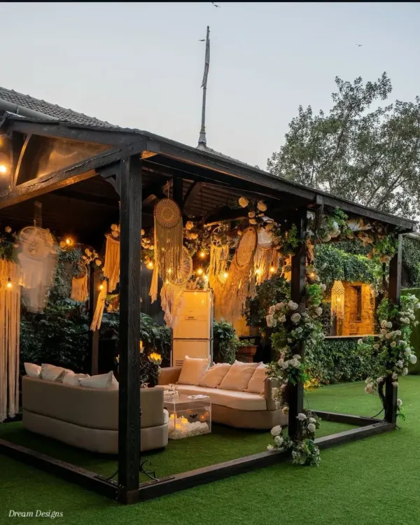 A cozy and stylish outdoor lounge I designed at Gallops Mumbai. This bohemian-inspired cabana features comfortable sofas, macrame dreamcatchers, and climbing white roses, creating the perfect spot for guests to relax.