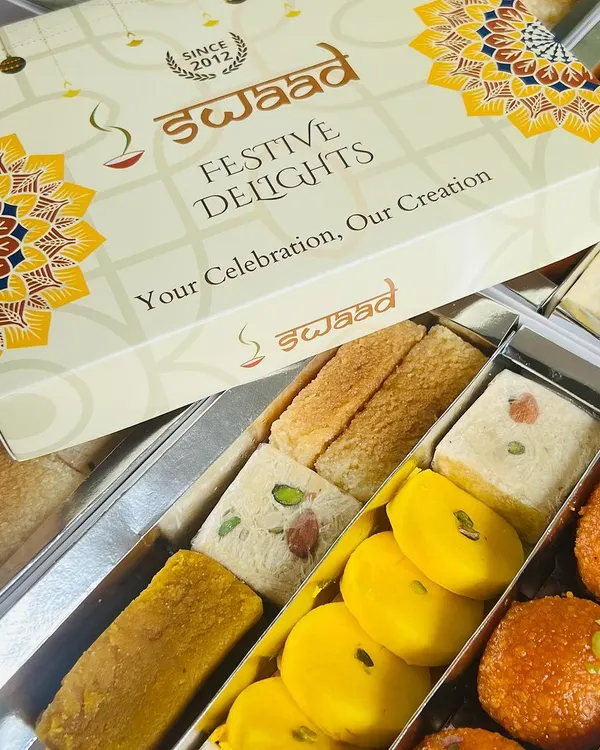 Our 'Festive Delights' box is perfect for corporate gifting, offering a curated selection of our finest sweets. This assorted mithai box includes favourites like Motichoor Ladoo, Peda, and various barfis, all packed under your custom branding.