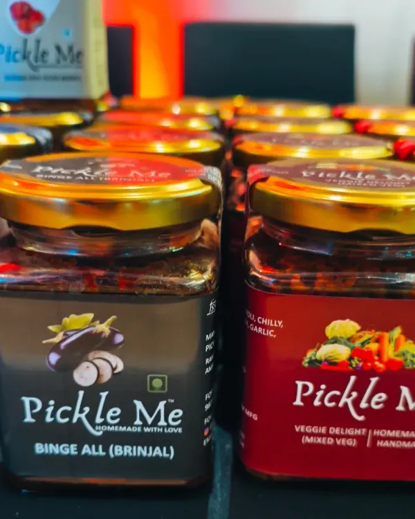 A close-up of our vegetarian stars: the 'Binge All' Brinjal pickle and our 'Veggie Delight' Mixed Veg pickle. Both are handmade with love and fresh farm vegetables.