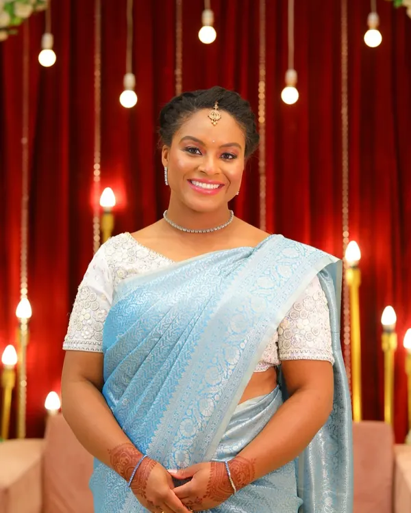 It was a joy to get this lovely guest ready for an Indian wedding. I created a soft, elegant look with a braided hairstyle that complemented her beautiful light blue saree.
