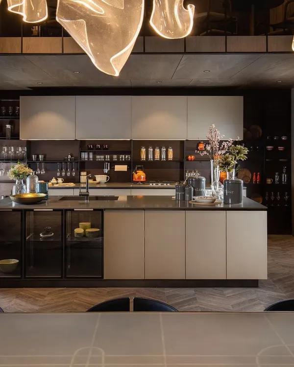 I design kitchens as the true heart of the home, seamlessly integrated with your living spaces. This open-plan modular kitchen features a central island that serves as both a preparation area and a concealed crockery unit, while integrated backsplash storage keeps countertops uncluttered and pristine.