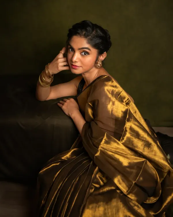This is the essence of my painterly style. I use light and shadow to craft a portrait that feels timeless, capturing the quiet strength and grace of the woman in the frame. This image, with its rich golden tones and classic composition, is more than a photo; it's a piece of art celebrating her story.