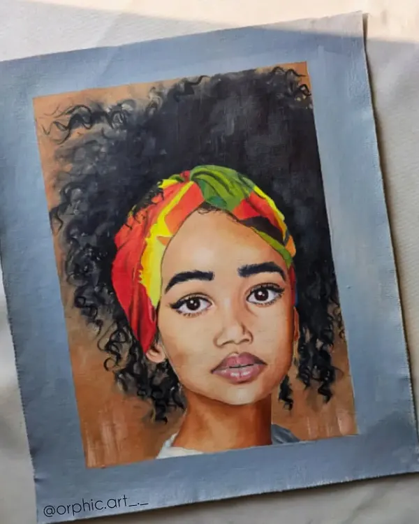 This is a finished oil portrait of a woman with a colorful headwrap and beautiful curly hair. I enjoyed working on the different textures in this piece, from her skin to her hair and the fabric of the wrap.