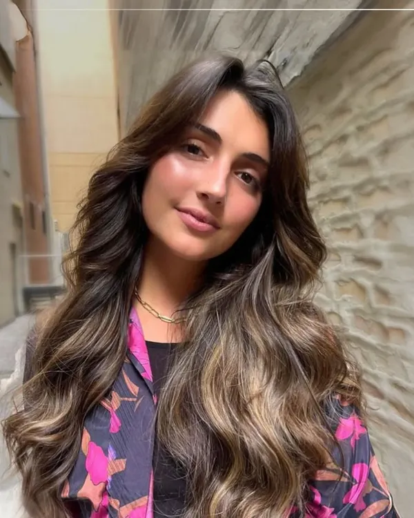 This is the beauty of balayage. Notice how the hand-painted highlights create a seamless, natural-looking gradient that adds dimension and movement, perfectly mimicking how hair lightens in the sun.
