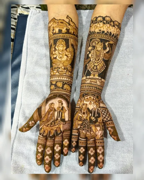 This is the kind of masterpiece I love creating for my brides. It features detailed portraits of the couple, sacred figures like Lord Ganesha and Shrinathji for blessings, and traditional motifs like elephants, telling a complete story on your arms. Every element is drawn with precision to make your bridal mehndi unforgettable.