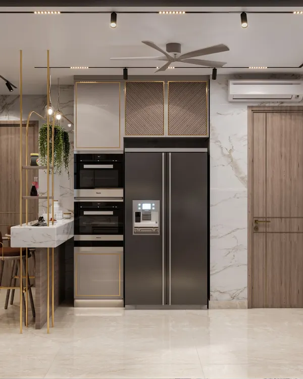 This Gurugram kitchen features a modern minimalist vibe with integrated appliances and a stylish breakfast bar. We used a mix of PU veneer and golden profiles to infuse a sense of luxury.