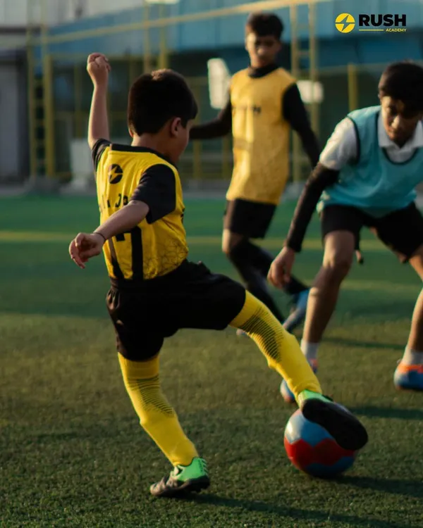 A young player from our U11 squad practices his shooting technique. We focus on repetition and form to ensure skills like striking the ball become second nature.