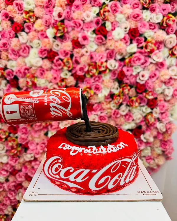 A full view of the gravity-defying Coca-Cola cake. This unique design is always a conversation starter and shows my ability to execute complex, creative concepts.