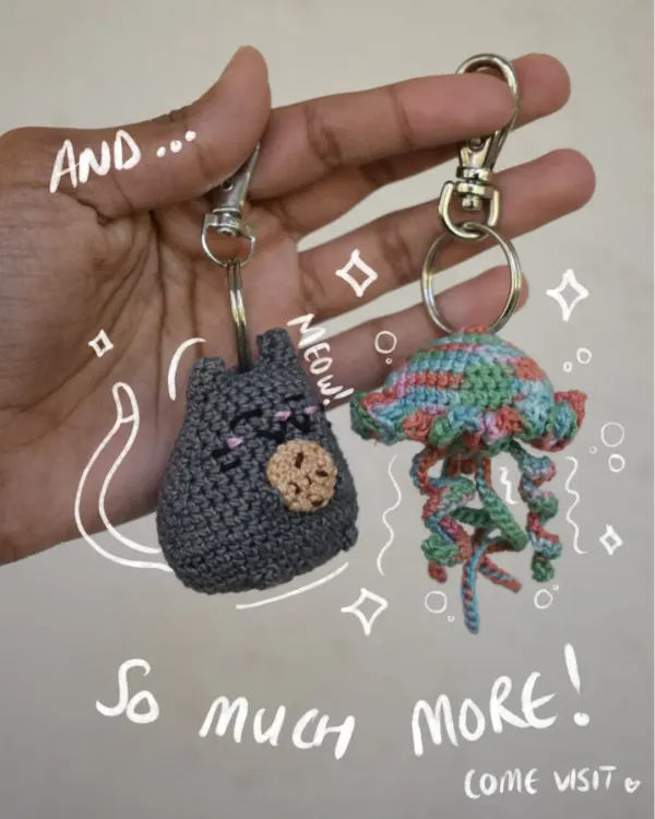This photo shows the variety of keychains I offer, from a sleepy cat to a colorful jellyfish. Each one is handmade and can be customized.