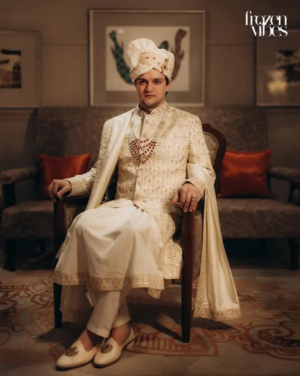A classic, regal portrait of the groom in his wedding sherwani. I aim to capture a sense of quiet confidence and anticipation on the wedding day.
