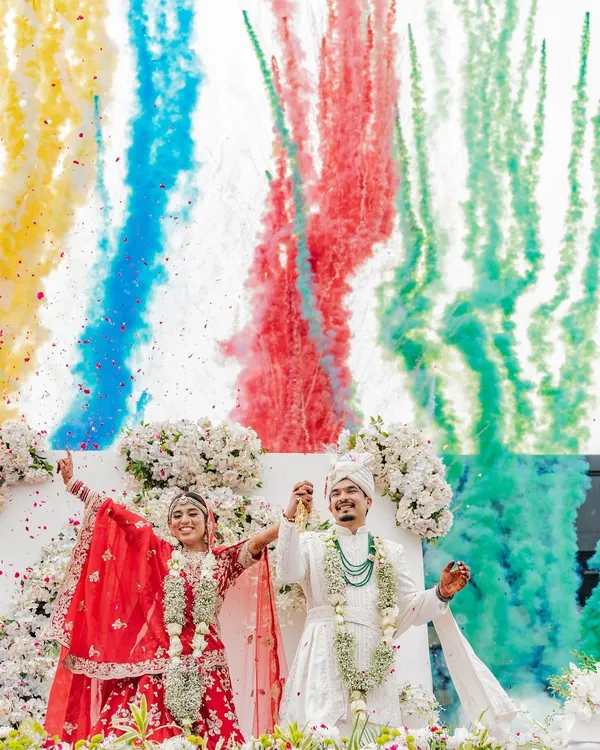 This is the moment every wedding builds up to. I captured Rahul and Riya during their Varmala, surrounded by a symphony of colors and cheers. My goal is to freeze these peak emotions, creating a memory that feels as explosive and beautiful as the moment itself.
