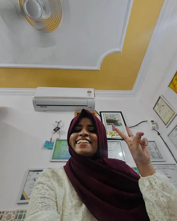 A happy selfie in my studio with my new AC. I believe in investing in yourself and your workspace. The certificates on the wall are a testament to my dedication.