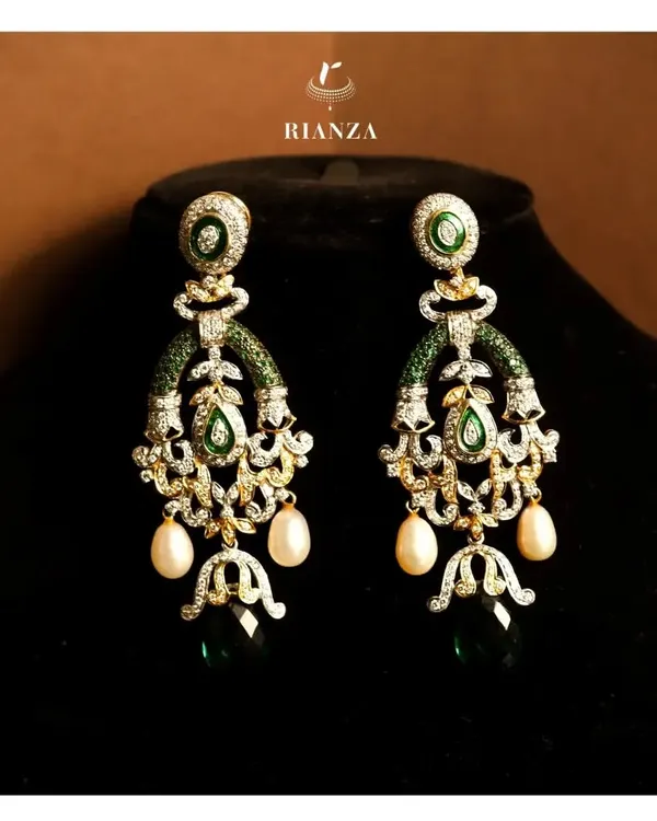 These versatile danglers feature a beautiful arrangement of emeralds, diamonds, and pearl drops. I designed them to be lightweight yet impactful, suitable for any festive outfit.