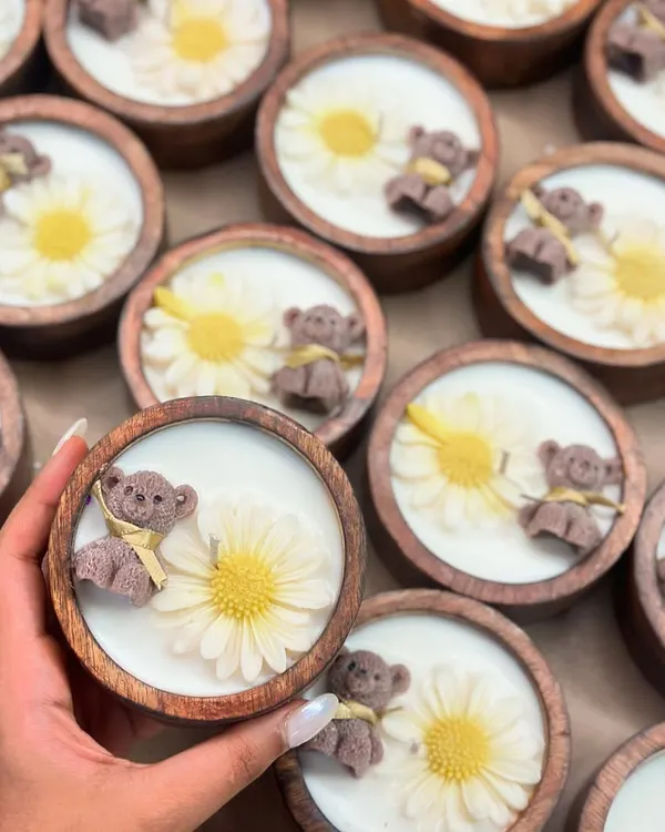Tiny toes, teddy glows, and daisy dreams in a wooden bowl. My Baby Shower candles, with their cute wax teddies and flowers, are the sweetest way to say 'Welcome, little one'.