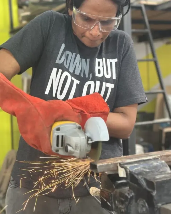 This is the moment you find your focus. We guide you through every step, ensuring you feel confident and safe as you learn to handle power tools and shape metal.