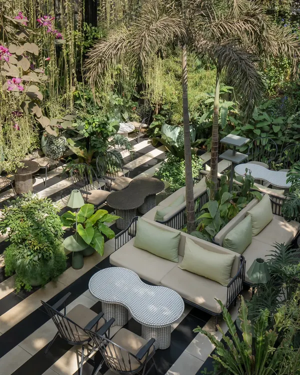 This high-angle view of the Sunrise restaurant project captures the essence of my biophilic design approach. I created a multi-level garden oasis where seating areas are nestled amongst lush foliage, blurring the line between a building and a landscape.