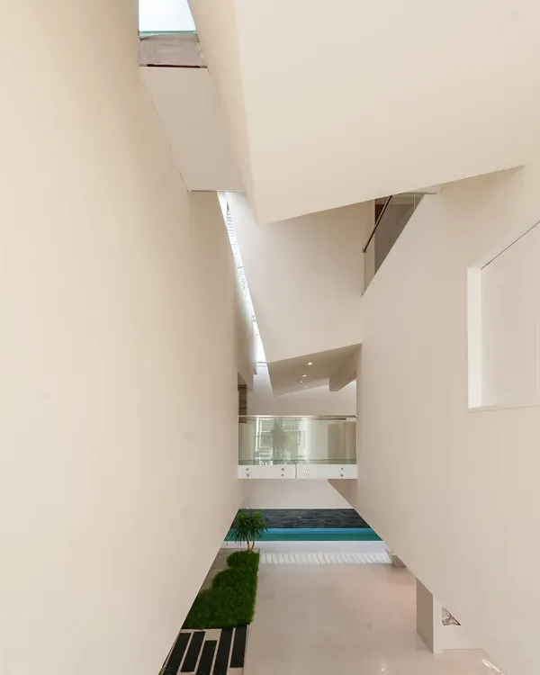 The resulting interior volume at the Neeti Residence. This is what we mean by designing with the bones of a space, where overlapping planes and natural light create a dynamic yet serene environment.