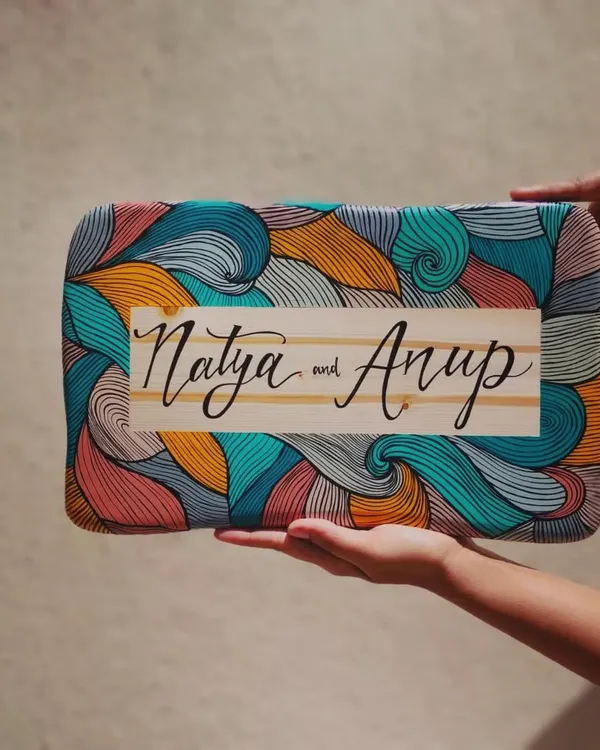 This hand-painted boho name plaque, with its intricate line art and vibrant colors, is a perfect example of how we bring your unique story to life. We loved creating every detail of this piece for a wonderful newlywed couple.