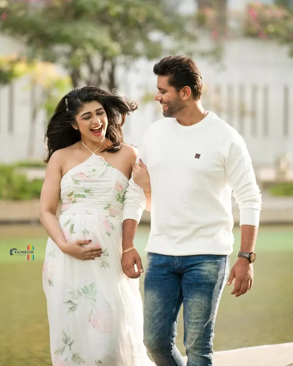 A beautiful, candid moment from actress Aditi Prabhudeva's maternity shoot, capturing the laughter and love between the couple.