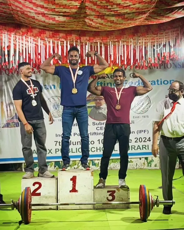 Victory at the National Deadlift Championship. My lifter stands at the top of the podium, a testament to our focused training and dedication.