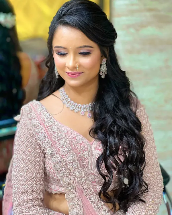 My beautiful engagement bride flaunting in hues of pink. This look features soft, romantic makeup and cascading curls.