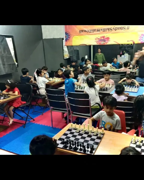 A wide view of our chess class in full swing during the summer camp. The room is buzzing with quiet concentration as students engage in matches and learn new strategies.