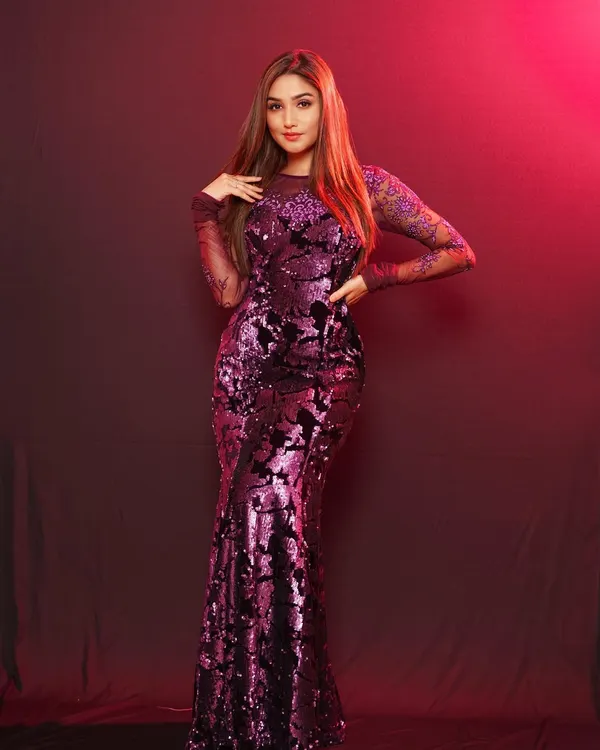 For this celebrity photoshoot with actress Donal Bisht, I used dramatic red and purple lighting to complement her sequined gown. The goal was to create a powerful and glamorous portrait that highlights both the intricate design of the dress and her commanding presence.