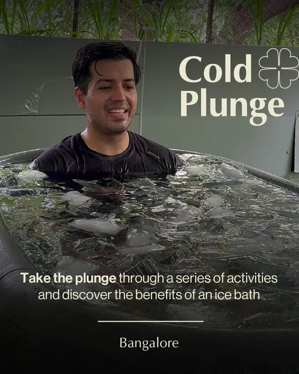 A participant embraces the challenge of the cold plunge. Our guided ice bath sessions in Bangalore are a powerful way to discover the benefits of cold exposure for recovery and focus.