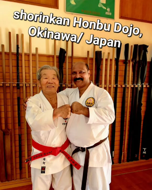 A cherished moment with my teacher at the Shorinkan Honbu Dojo in Okinawa. These personal interactions are where the true spirit and technique of the art are passed down.